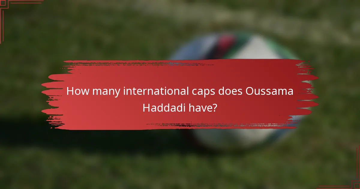 How many international caps does Oussama Haddadi have?
